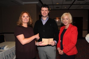 Keith Mulready, poster prize winner being congratulated by Dr Susan Knowles, ISCM and Connie Merrick, MSD, prize sponsors